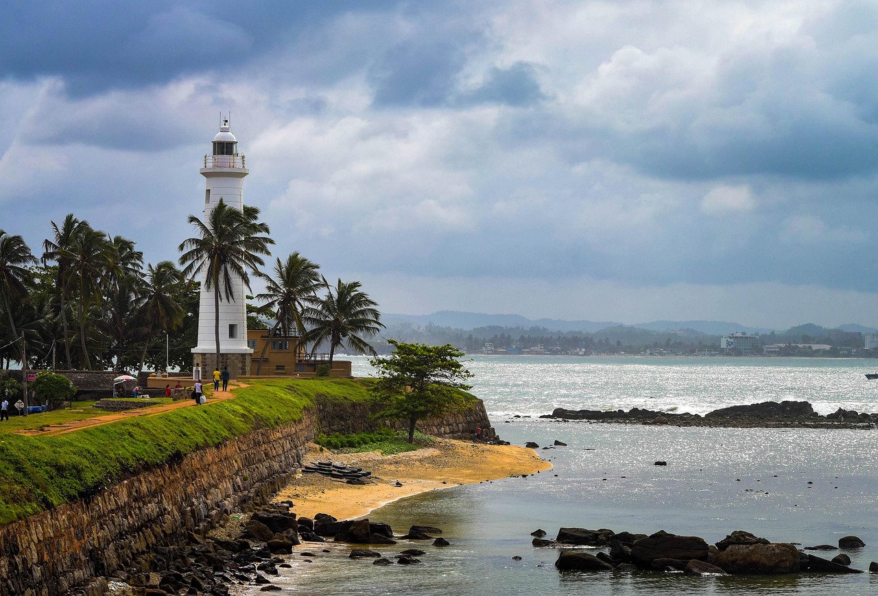 Panoramic view of historic Galle city ramparts and the iconic Lighthouse against the Indian Ocean, Sri Lanka.